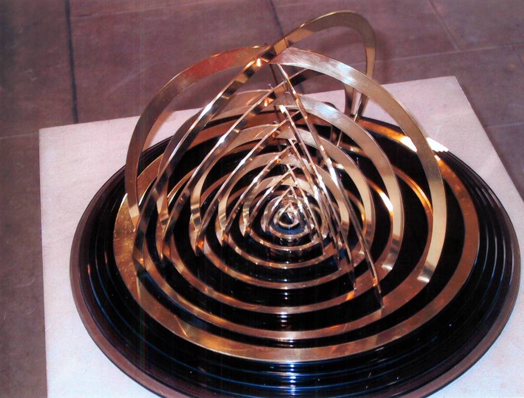circular sculpture cut in brass